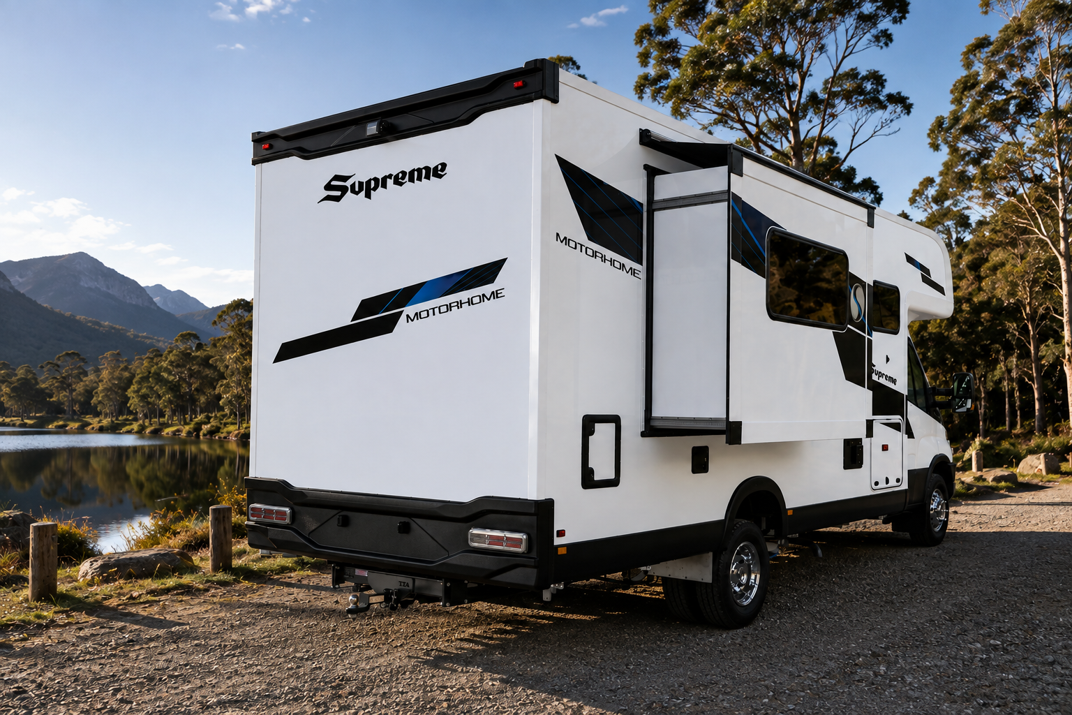Supreme Motorhome rear three-quarter view beside a lake